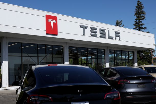 Brand new Tesla cars sit parked at a Tesla dealership on May 31, 2024 in Corte Madera, California